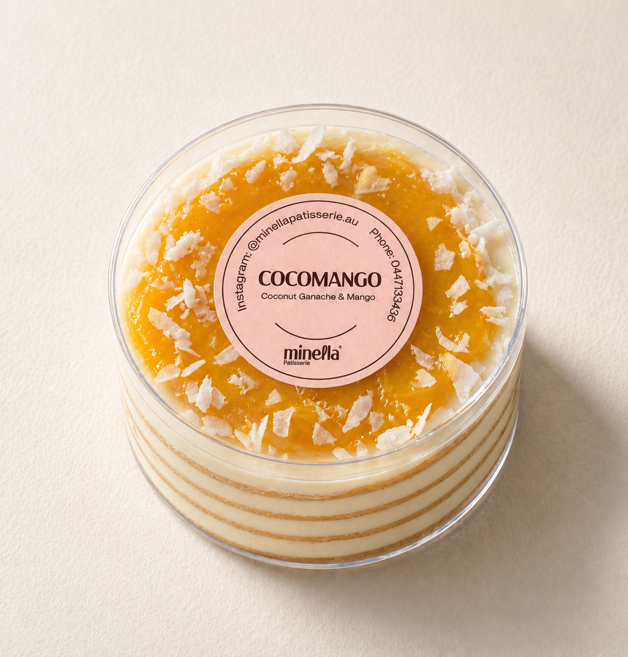 Mango layered Honey Cake with a slice removed, showing its interior layers.