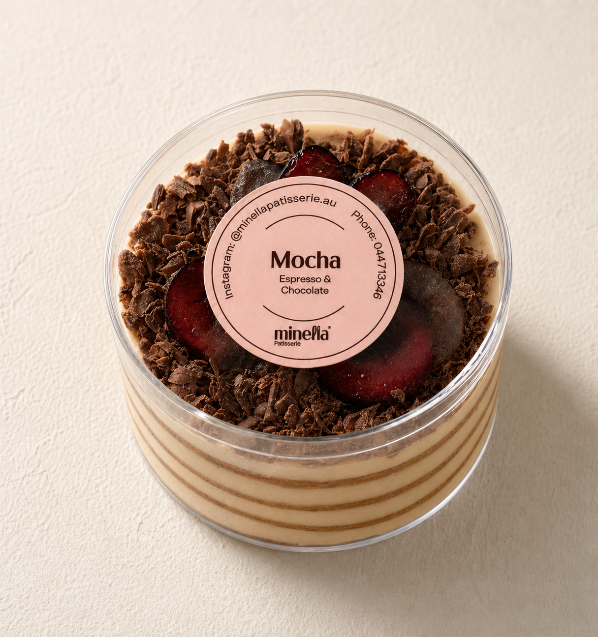 Mocha coffee layered Honey Cake with a slice removed, showing its interior layers.