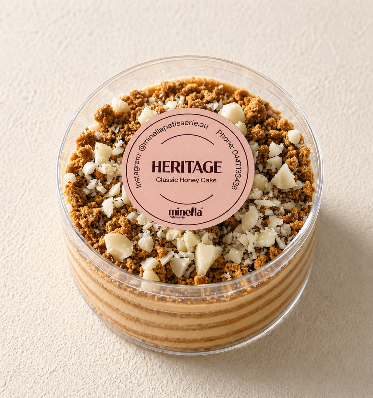 original caramel layered Honey Cake with a slice removed, showing its interior layers.